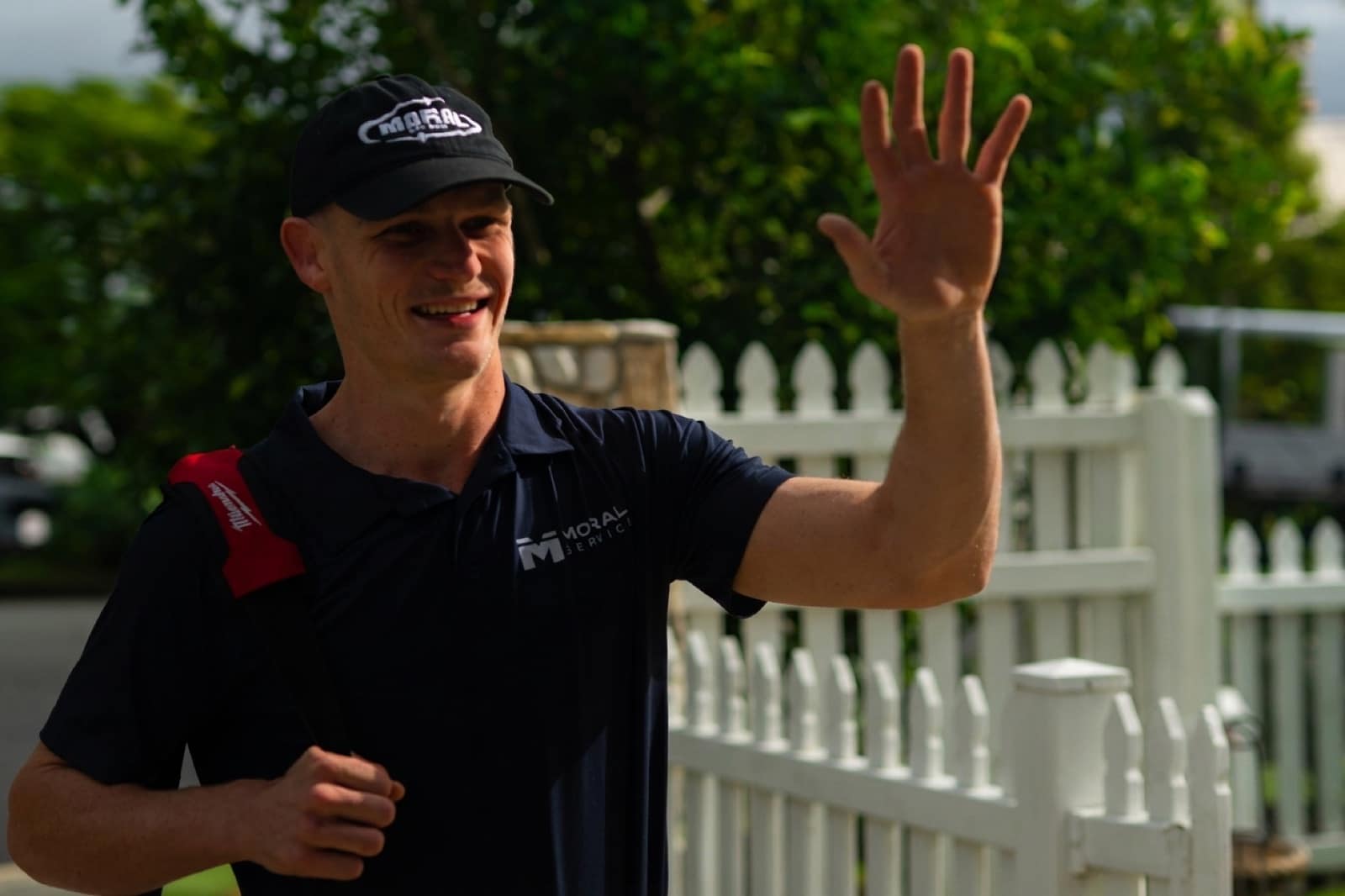 Justin from Moral Service waving as he arrives at a Gold Coast home