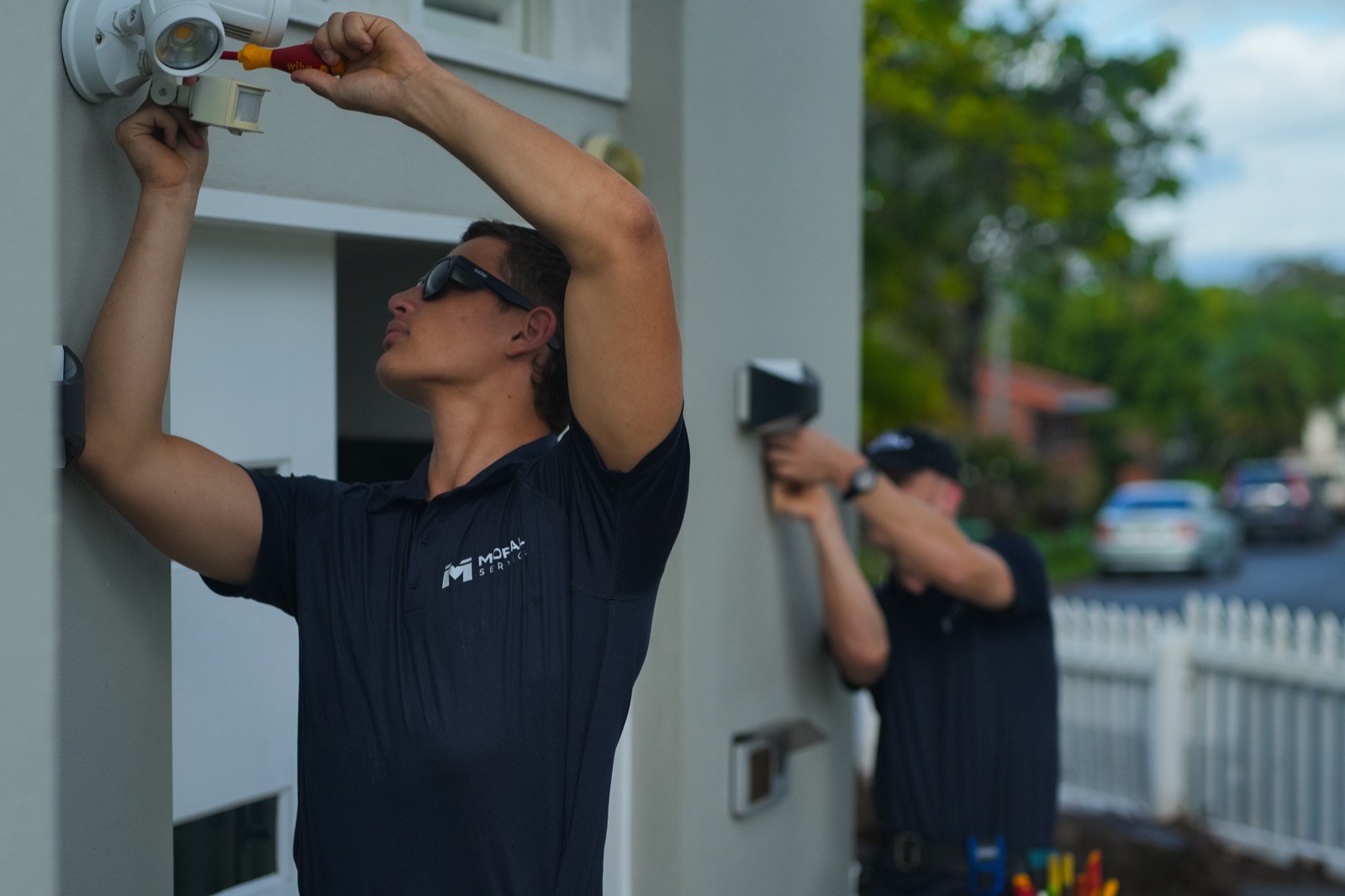 Outdoor lights being installed on a Gold Coast home